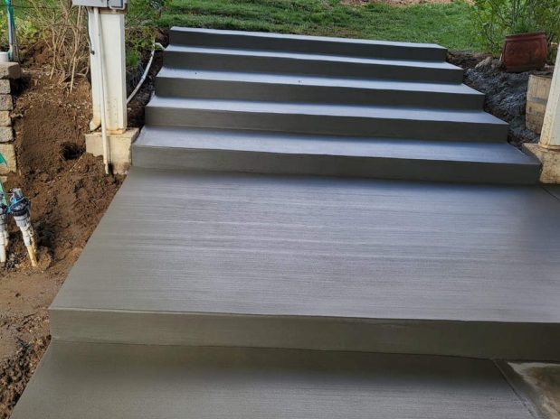 Concrete stairs leading up to a residential building.