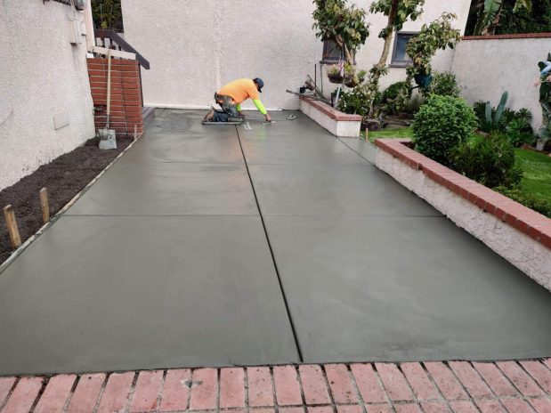 Newly installed concrete driveway with smooth finish and clean edges.