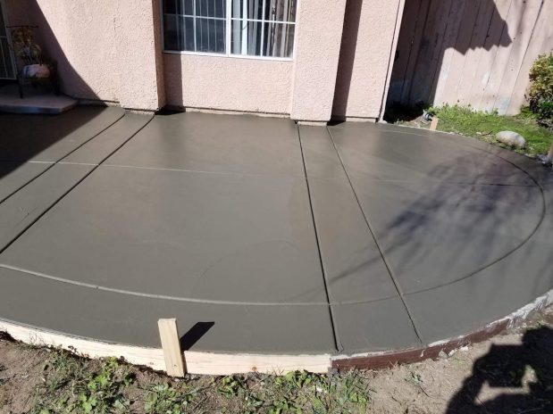 A concrete patio with a smooth concrete slab.