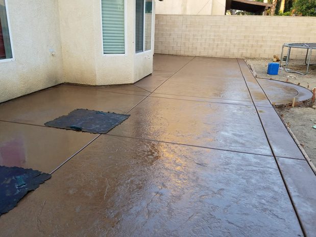 Spacious concrete patio featuring a large slab.