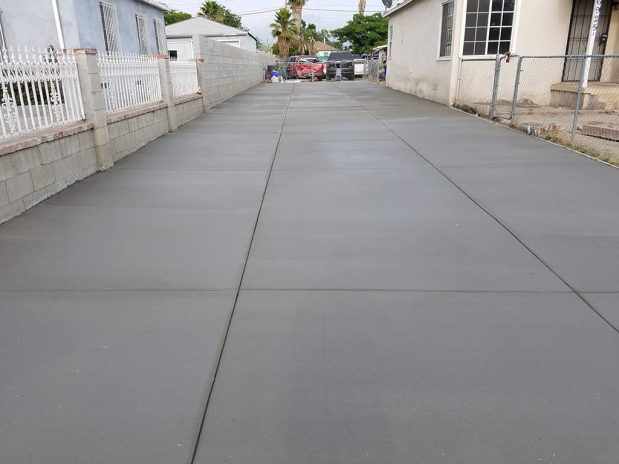 A driveway made of concrete.